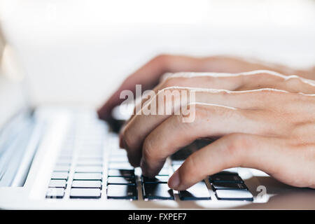 Close-up of hands typing on keyboard (Selective focus) Stock Photo