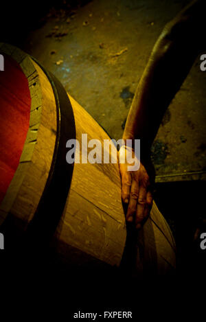 Hand touching wooden cask Stock Photo