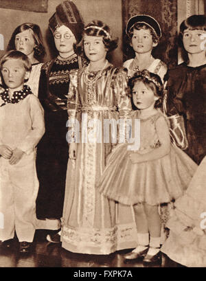 Princess Elizabeth, the future Queen Elizabeth II, at a fancy dress party with her sister Margaret in 1934 Stock Photo
