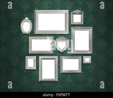 Empty picture frames on green wall Stock Photo