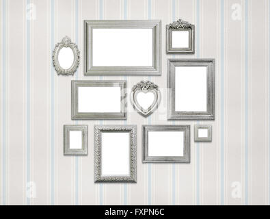 Empty picture frames on green wall Stock Photo