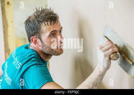 apprentices learning trades of carpentry, joinery and decorating Stock Photo
