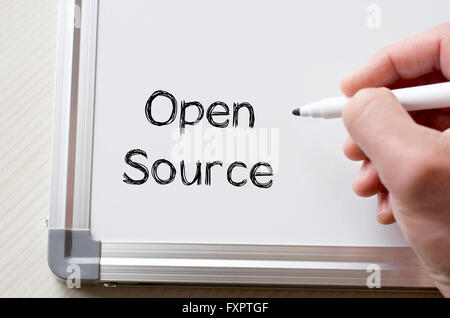 Human hand writing open source on whiteboard Stock Photo