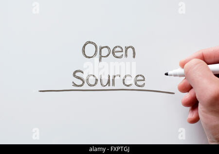 Human hand writing open source on whiteboard Stock Photo