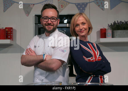 London, UK. 17th April, 2016. Preparing herself for a visit to Buckingham Palace this coming Thursday to celebrate her Majesty the Queen 90th Birthday Mich Turner wore a jumper with the Union Jack  to the International Cake Show in Alexandra Palace pictured here with fellow professional chocolateur Will Torrent. Credit:  Paul Quezada-Neiman/Alamy Live News Stock Photo
