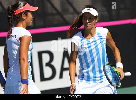 Kyiv, Ukraine. 17th April, 2016. Guadalupe Perez Rojas (L) and Maria Lourdes Carle of Argentina in action during BNP Paribas FedCup World Group II Play-off pair game against Ukraine at Campa Bucha Tennis Club in Kyiv, Ukraine. Ukraine won pair game 6-1, 6-3. Credit:  Oleksandr Prykhodko/Alamy Live News Stock Photo