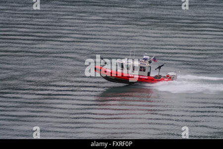 U.S. Coast Guard Defender-class response boat number 25759, built by SAFE Boats International, patrolling on calm waters. Stock Photo