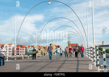 Queen Emma Bridge is a floating pontoon pedestrian bridge joining the Pinda and Otrabanda sides of Willemstad Curacao Stock Photo