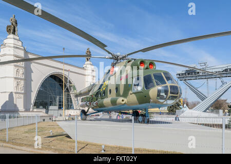 Moscow, Russia - March 29, 2016: Russian military helicopter MI-8 near the pavilion 'Space' at the VDNH Stock Photo