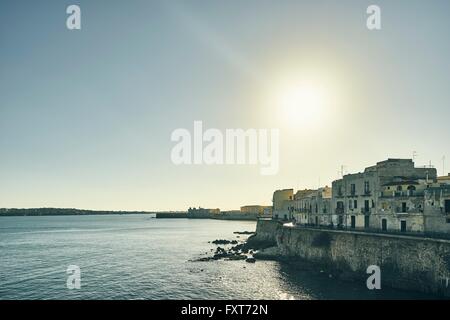 Waterfront houses on coast of Ortigia, Syracuse, Sicily, Italy Stock Photo