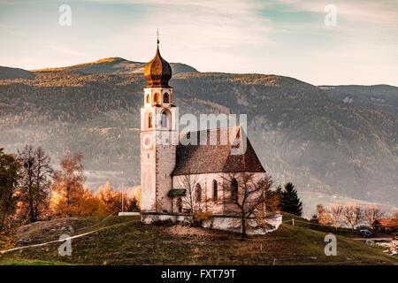 Traditional church on hill, Dolomites, Italy Stock Photo