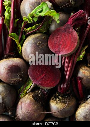 Raw beetroot, whole and sliced in half Stock Photo