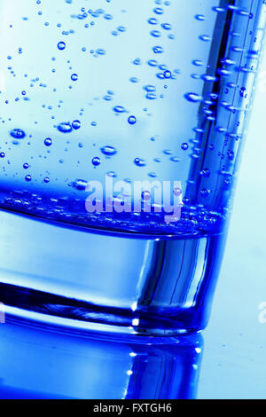 blue bubbled water in glass Stock Photo