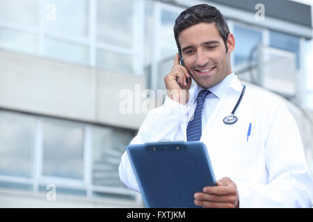 Young doctor stood outside Stock Photo