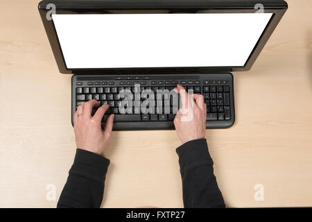Hand pressing the backspace key Stock Photo