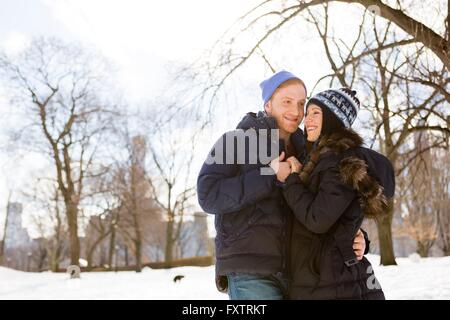 Romantic young couple in snowy Central Park, New York, USA Stock Photo