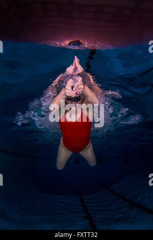 Woman swimming naked underwater Stock Photo - Alamy