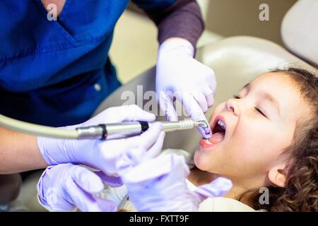 Cropped view of girl in dentist chair having dental examination Stock Photo