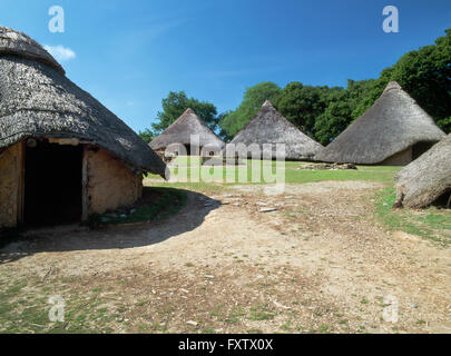 Reconstructed roundhouses at Castell Henllys defended settlement occupied during the Late Bronze Age & Iron Age, Pembrokeshire, South West Wales, UK Stock Photo