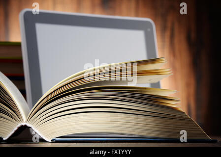 Composition with books and tablet computer. Stock Photo