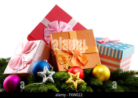 Colorful gift boxes and christmas tree isolated on white. Stock Photo