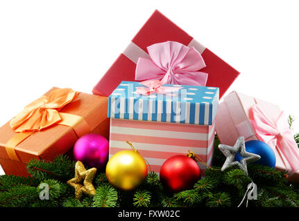 Colorful gift boxes and christmas tree isolated on white. Stock Photo