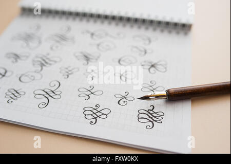 abstract calligraphic figures hand drawing pointed stylus Stock Photo