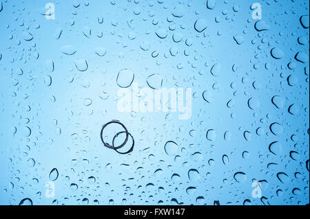 background drops of water and two rings on the glass Stock Photo