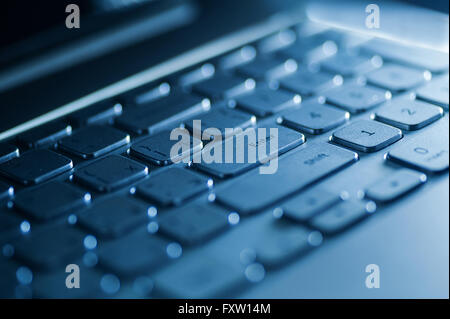 keyboard on a laptop in blue color Stock Photo