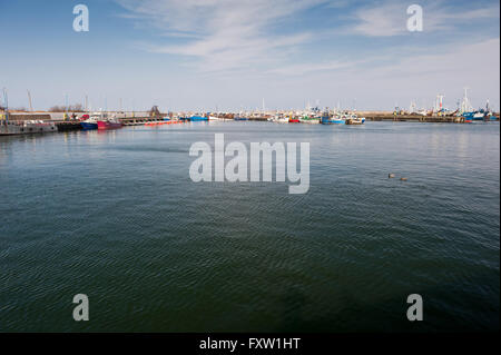 Fishing vessels at shore in Szkuner harbour in Wladyslawowo, Poland, Europe. Moored ships in a Schooner fishing docks Stock Photo