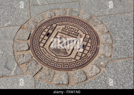 Sopot manhole cover of sewage well at the Sopot Friends Square, Plac Przyjaciol Sopotu in Poland, Europe, cast iron sewer cover Stock Photo