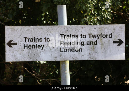 An Aluminium sign on the other side of the track with a white background and black contrasting lettering with arrows Stock Photo