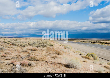 A car-free stretch of Highway 50, The Loneliest Road in America, in the desert of Nevada.