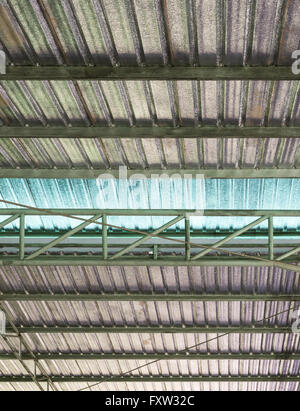 Metal sheet roof with insulation corrugated of the modern factory in Thailand. Stock Photo