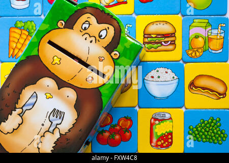 Greedy Gorilla game showing food cards and gorilla - feed the junk food to the gorilla while you make up a healthy meal Stock Photo