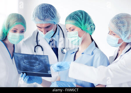 young group of doctors looking at x-ray Stock Photo