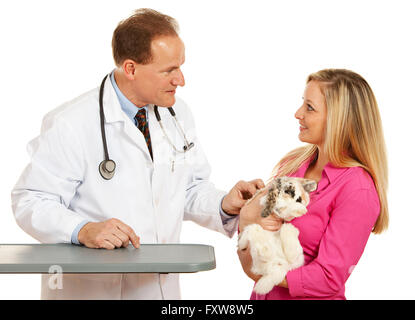 Series with a Cacucasian Veterinarian, and mixed-ethnicity group of assistants and customers.  Holding rabbit, cat and dog.  Iso Stock Photo