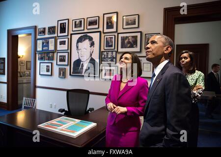 Vicki Kennedy, widow of Senator Ted Kennedy, shows President Barack Obama and First Lady Michelle Obama a replica of Kennedy's Senate office following the dedication of the Edward M. Kennedy Institute for the United States Senate March 30, 2015 in Boston, Massachusetts. Stock Photo