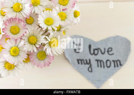 I love my mom written on denim heart. Happy mothers day Stock Photo