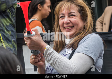 London, UK. 18th April, 2016.  SOAS cleaners leader Consuelo Moreno sounds a horn at London University SOAS protest demanding  management bring the cleaners in-house now. After 10 years of protest management have said they will at some future date employ the cleaners themselves while signing a new outsourcing contract. SOAS staff and students say do it now, or face continuing protests. Peter Marshall/Alamy Live News