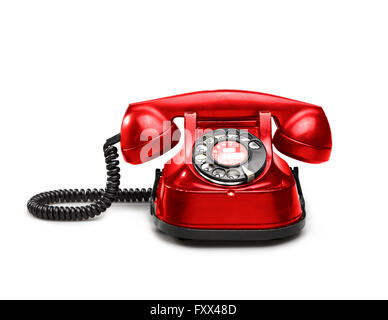 An old red telephon with rotary dial - clipping path Stock Photo