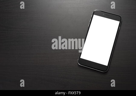 Smarphone on a dark table in the office, close-up Stock Photo