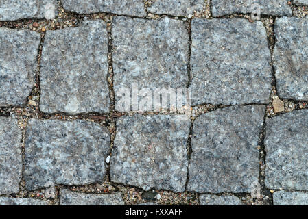 granite block pavement of the old street Stock Photo