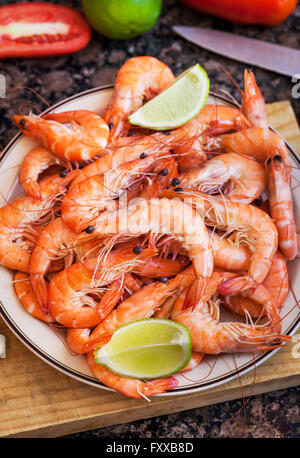 Fresh delicious prawns with lime on the plate Stock Photo