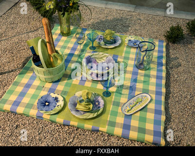 Picnic outdoor table setting demo and display in home and garden trade show Stock Photo