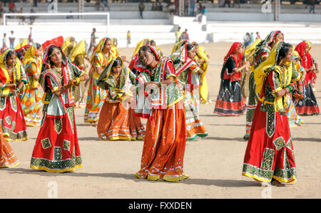 PUSHKAR, INDIA - NOVEMBER 21: An unidentified Indian girls in colorful ethnic attire dancing at Pushkar fair. Stock Photo