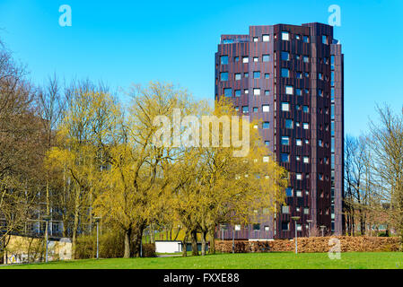 Lund, Sweden - April 11, 2016: Beautiful design and color choice on this high rise apartment building in town. Lovely surroundin Stock Photo