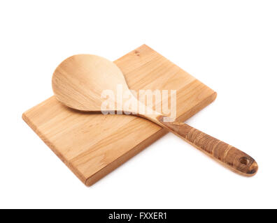 Wooden spoon over the cutting board isolated Stock Photo