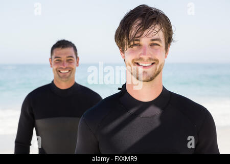 Handsome men wearing wetsuits Stock Photo