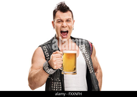 Studio shot of a male punk in an old black jacket holding a pint of beer isolated on white background Stock Photo